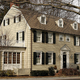 The real-life Amityville house in 2005, still recognizable even without those eye-shaped windows.